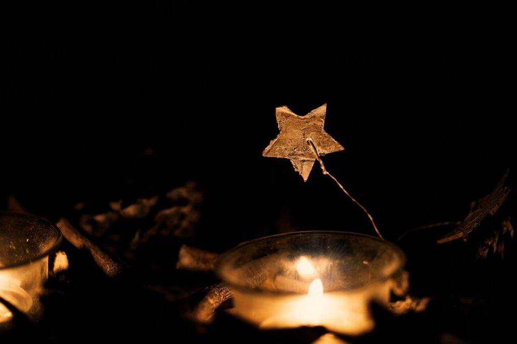 gold decorative christmas start and candle glow