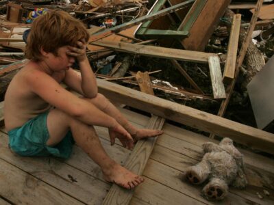 child in hurricane aftermath